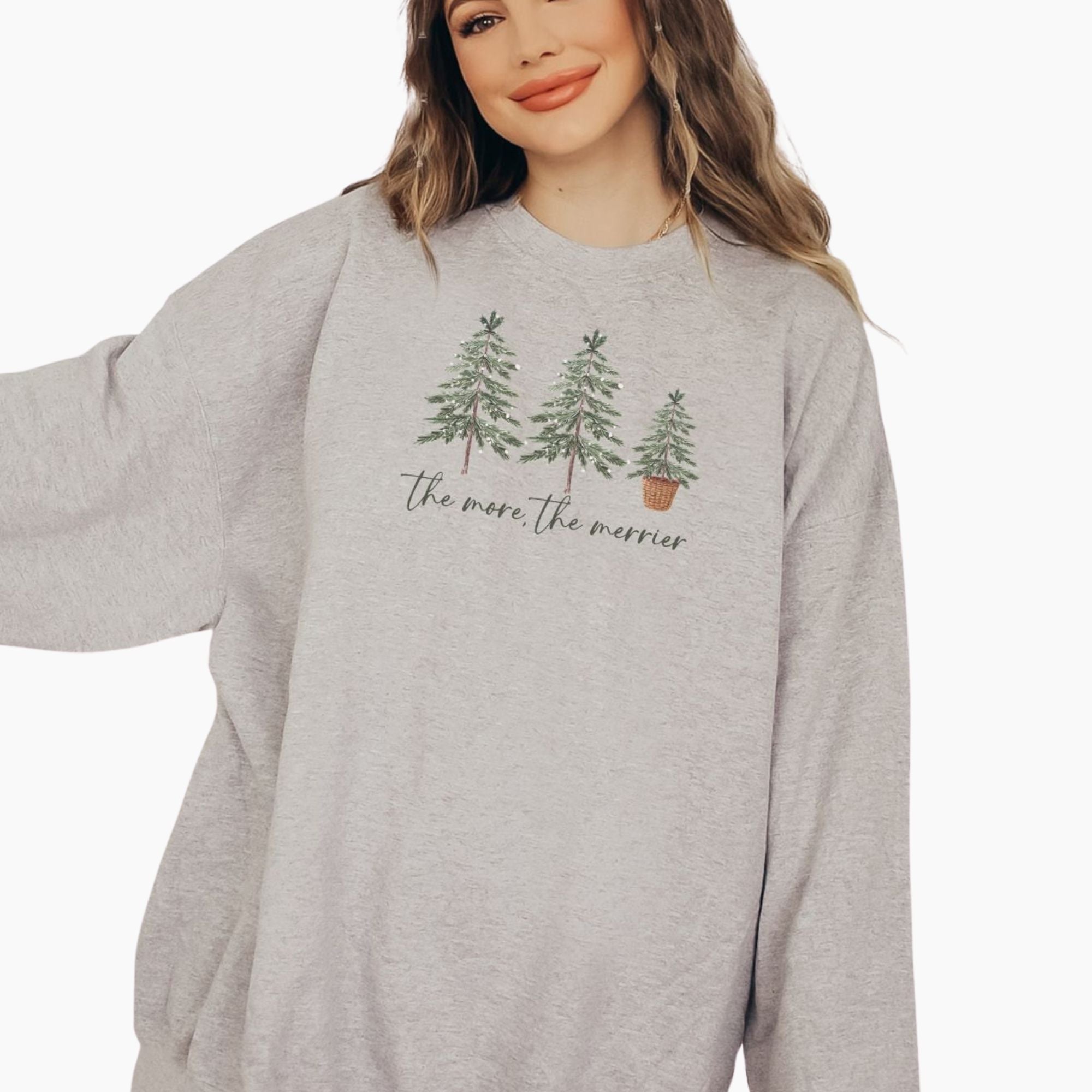The More The Merrier Christmas Pregnancy Sweatshirt – Holiday Maternity Crewneck, Baby Reveal Christmas Pullover, Funny Mom-to-Be Shirt